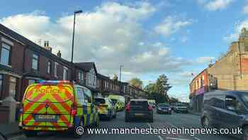 Police descend on Rochdale street after 'altercation' leaves man injured