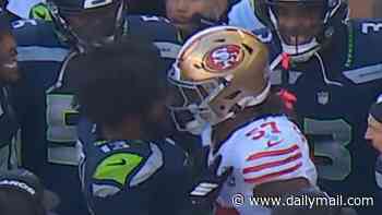 San Francisco 49ers star Dre Greenlaw ejected for headbutting helmetless Seahawks rival in senseless sideline bust-up