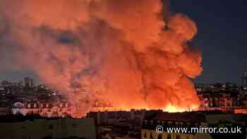 Fire ravages Paris tourist attraction with flames seen from miles away as emergency crews swarm