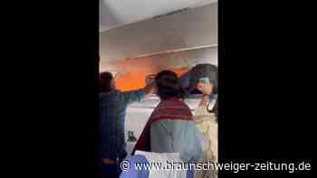 Powerbank fängt Feuer: Flugzeug muss notlanden – Video zeigt dramatische Szenen