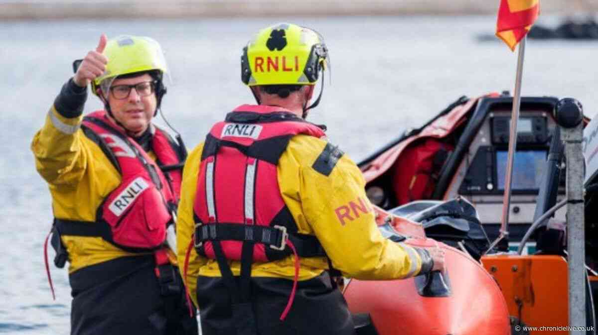 Father and son stranded on disappearing sand bank rescued on Northumberland coast