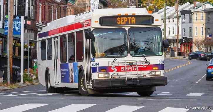 Armed man barricades himself on bus after ‘shooting two women in the head in burning building’