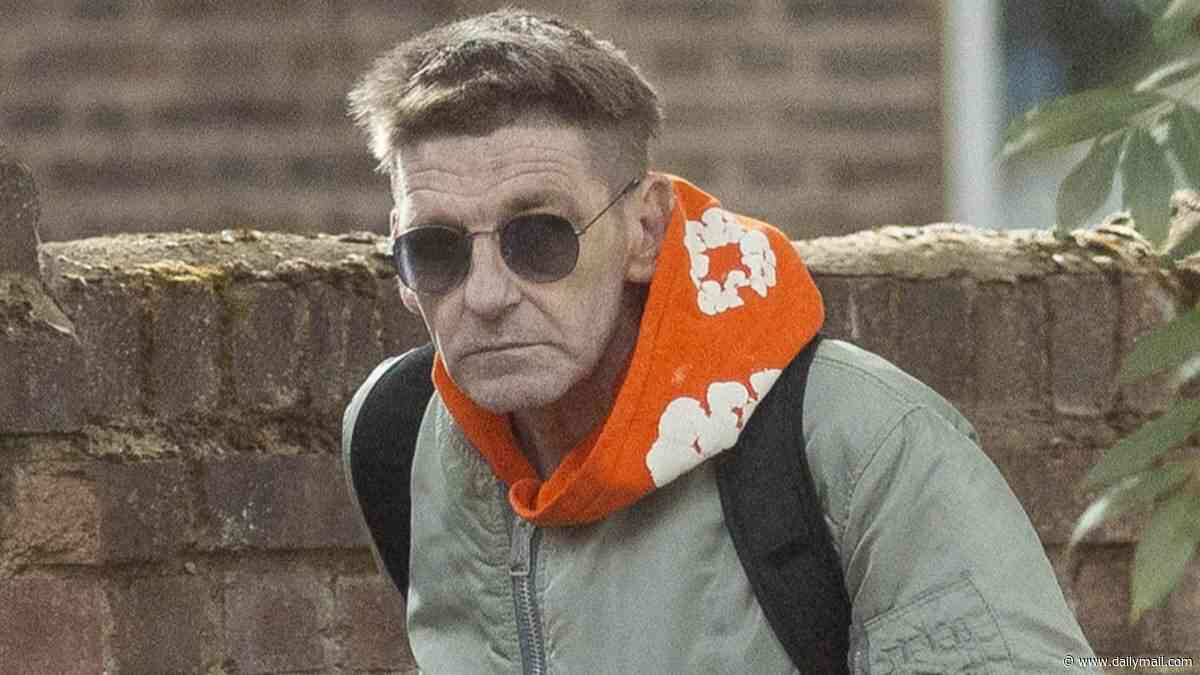 Troubled Peaky Blinders star Paul Anderson counts cash in the street as he runs errands on an e-bike after missing out on Netflix movie