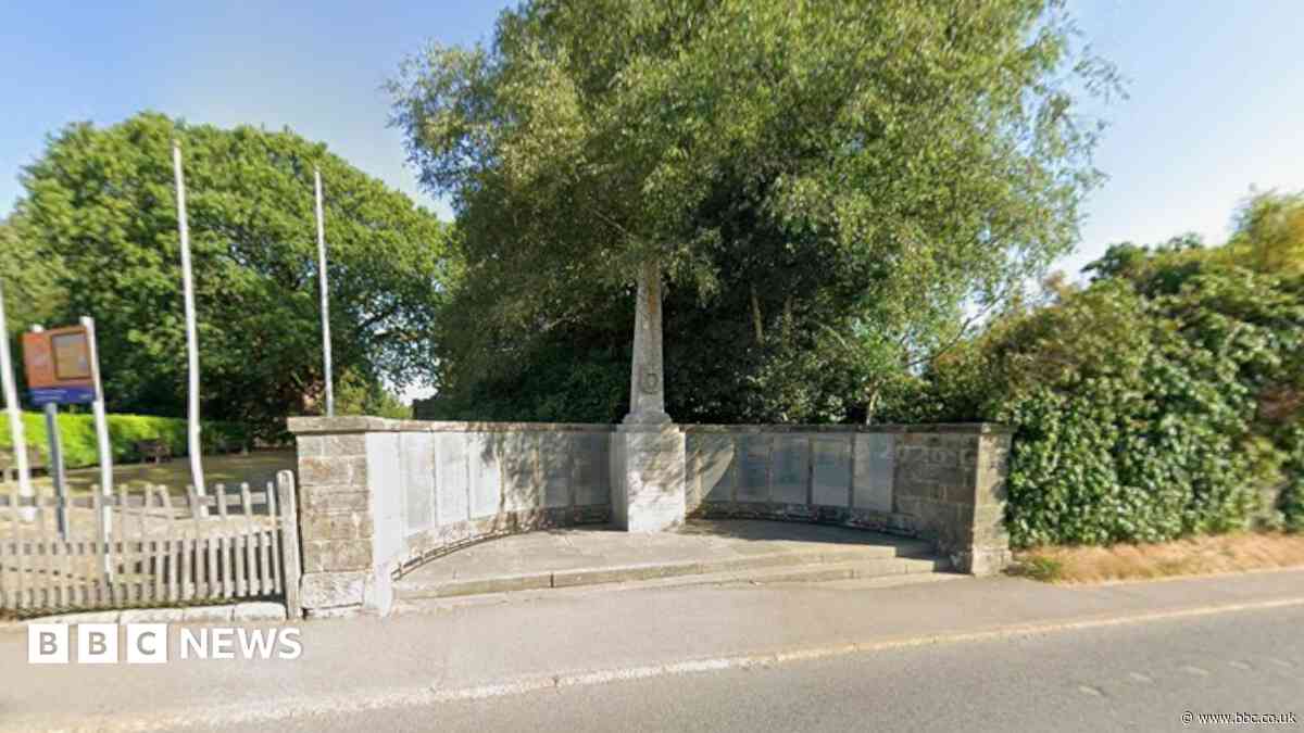 Arrest after car hits war memorial wall