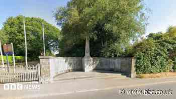 Arrest after car hits war memorial wall
