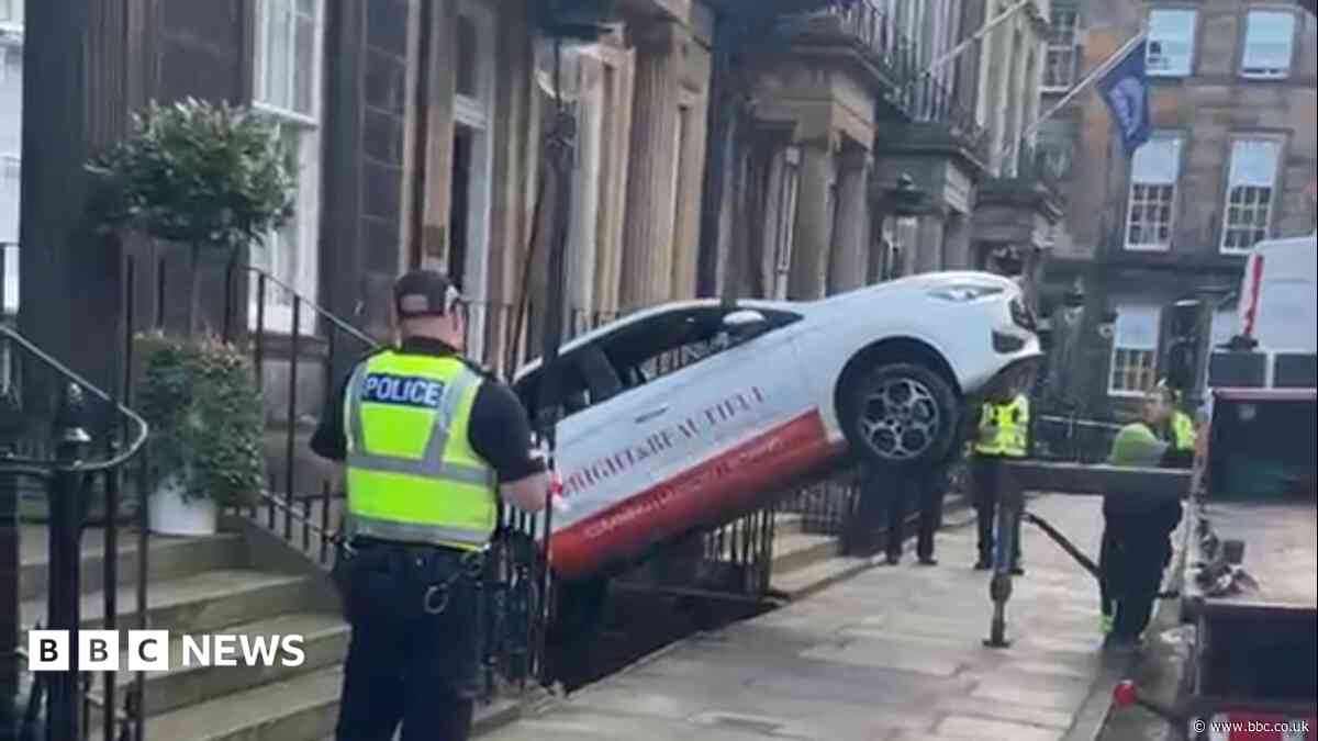 Woman charged after car crashes into Edinburgh basement