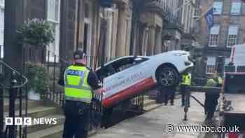 Woman charged after car crashes into Edinburgh basement