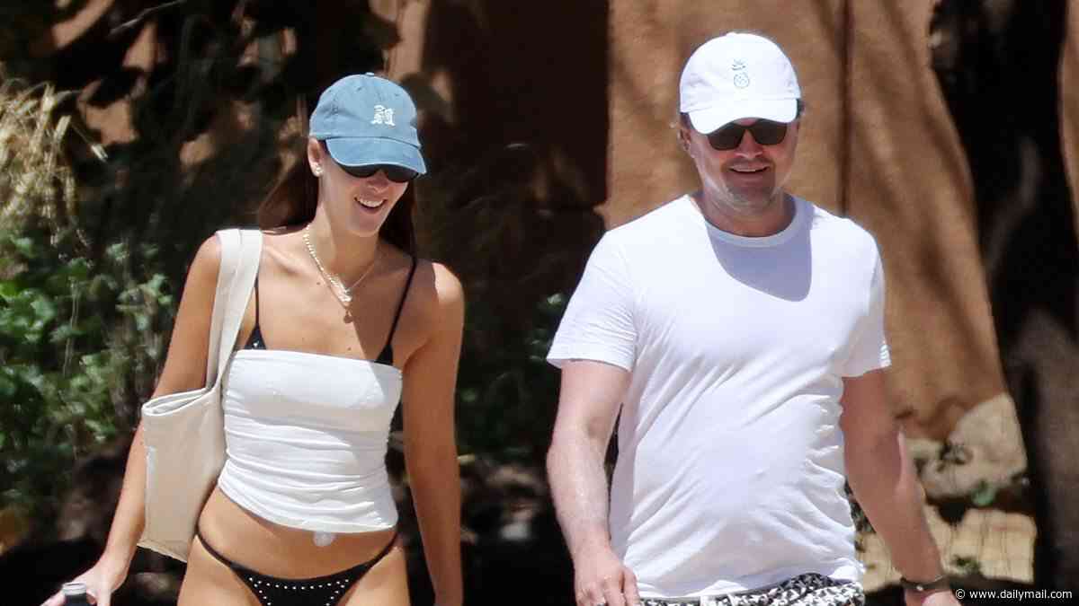Leonardo DiCaprio, 51, shows off his dad bod as he hits the beach with girlfriend Vittoria Ceretti, 28, and plethora of A-listers ahead of BFF Tobey Maguire's ex Jennifer Meyer's wedding