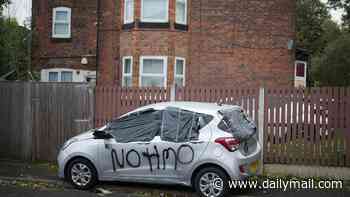 Homes and cars on Salford estate are defaced with anti-HMO slogans in graffiti crime spree: Boy, 13, is arrested