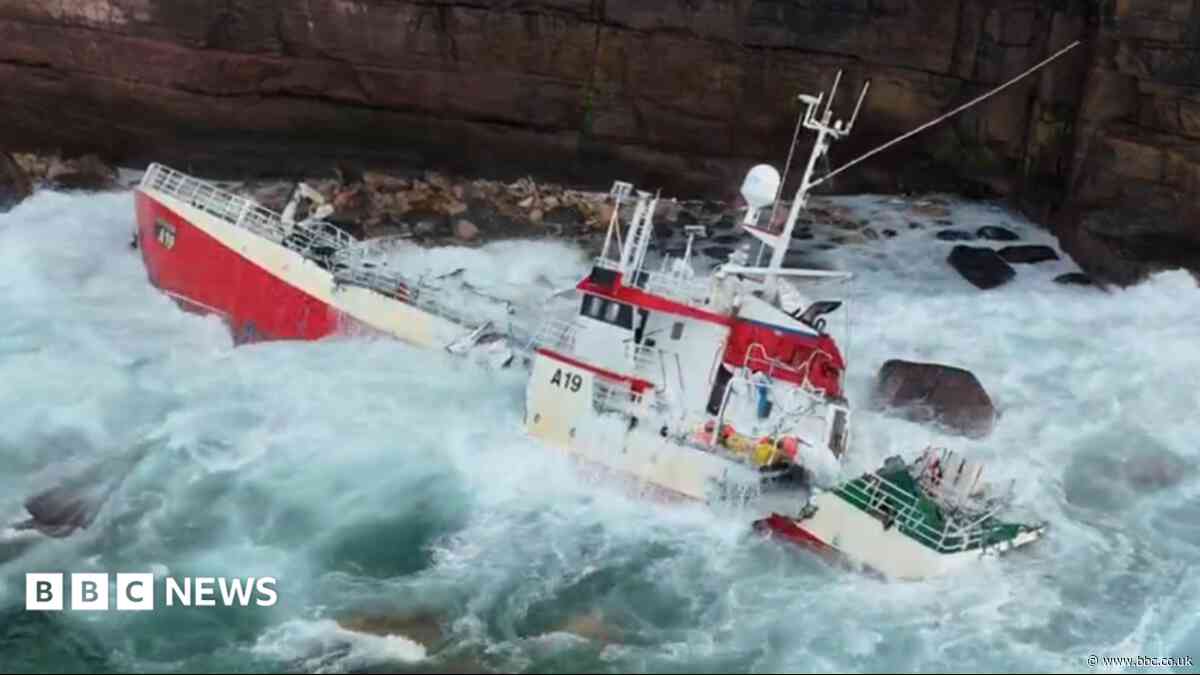 Dramatic footage shows fishing boat smashing apart on rocks