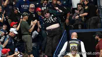 Trump rally descends into chaos as screaming protesters are dragged from Ohio stadium
