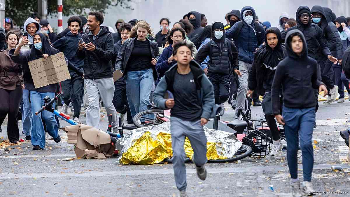 Police clash with protesters in Brussels as thousands march against spending cuts