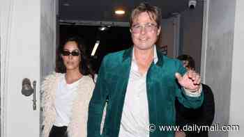 Brad Pitt, 62, turns heads in bold magenta trousers and a teal jacket on a date night with glamorous girlfriend Ines de Ramon, 33, in Paris