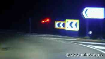 Shocking moment criminal hits stolen car on kerb and flies into air during 100mph police chase