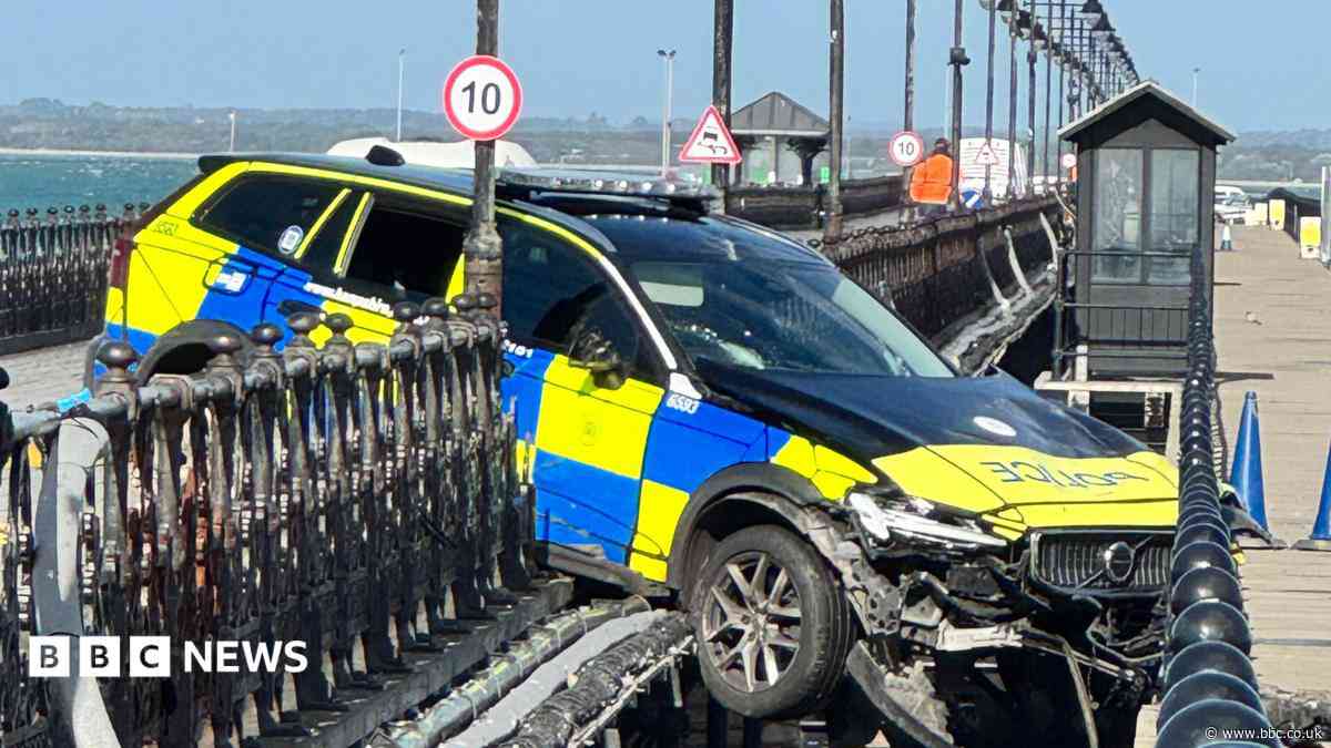 Police car removed after pier crash