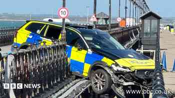 Police car removed after pier crash