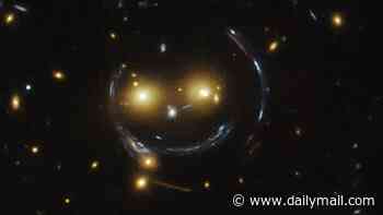 Say cheese! NASA reveals stunning image of giant 'cosmic smile' created by warped spacetime