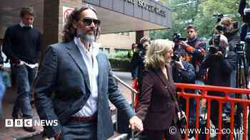 Russell Brand appears in court for start of rape trial