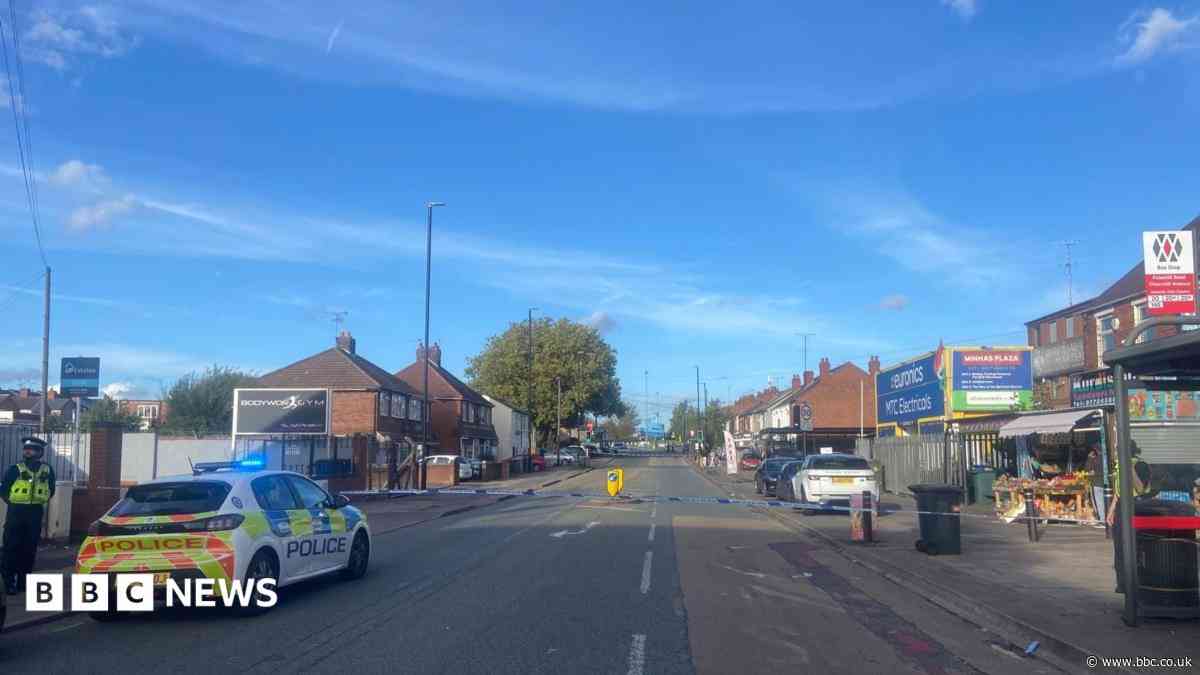 Road closed as police deal with rooftop incident