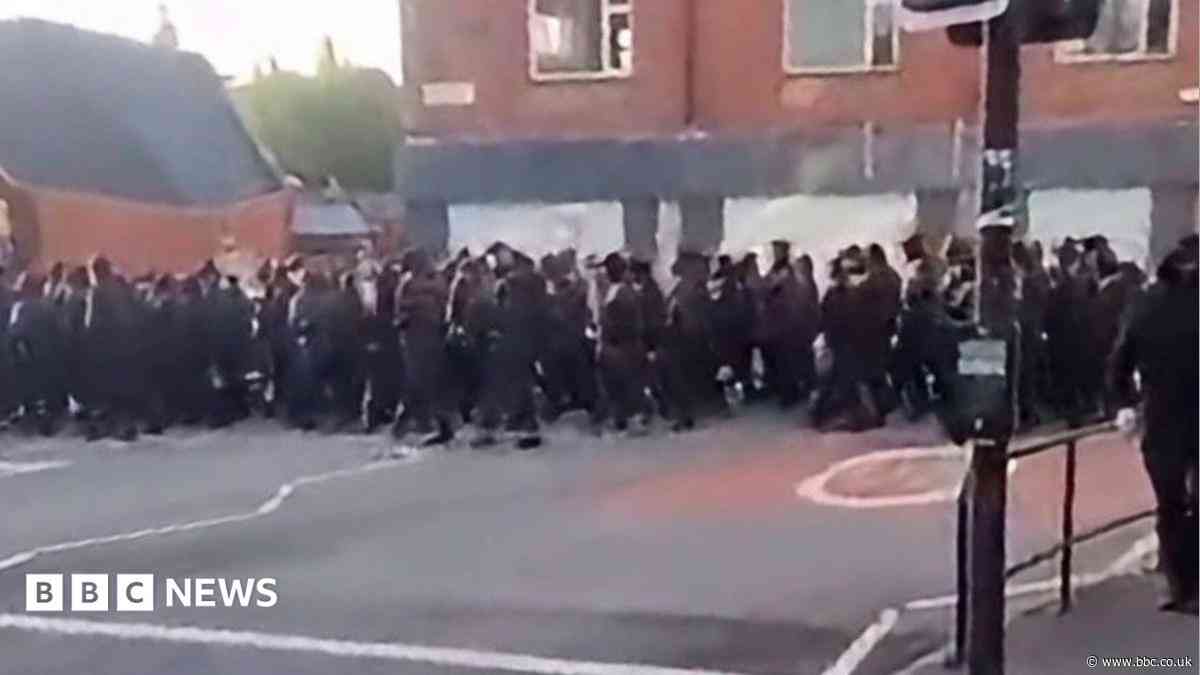 Politicians condemn early morning masked march