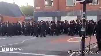 Politicians condemn early morning masked march