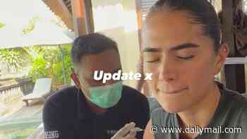 Romeo Beckham's girlfriend Kim Turnbull is forced to get a rabies jab after being bitten by a stray dog while on holiday in Bali