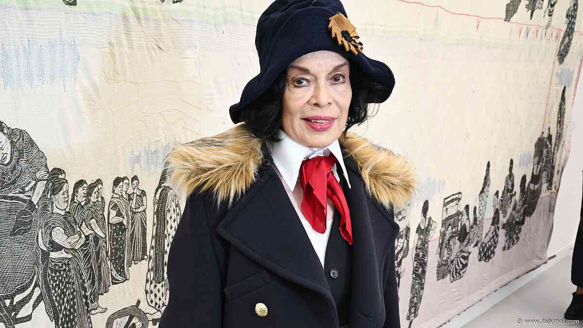 Bianca Jagger gives Northern Irish comedian Jimmy Cricket a run for his money in the style stakes as she attends the Frieze Art Fair in quirky suit ensemble and red tie
