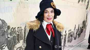 Bianca Jagger gives Northern Irish comedian Jimmy Cricket a run for his money in the style stakes as she attends the Frieze Art Fair in quirky suit ensemble and red tie
