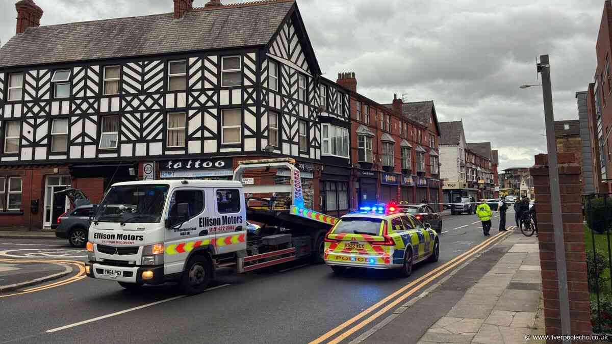 Man in hospital after Audi flips onto roof in Garston crash with parked vehicles