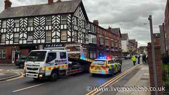 Man in hospital after Audi flips onto roof in Garston crash with parked vehicles