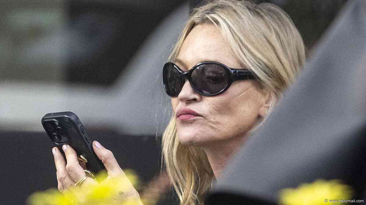 Kate Moss shows off her supermodel pout as she carries two vapes while enjoying an al fresco lunch date