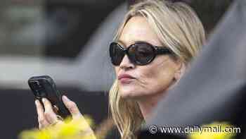 Kate Moss shows off her supermodel pout as she carries two vapes while enjoying an al fresco lunch date