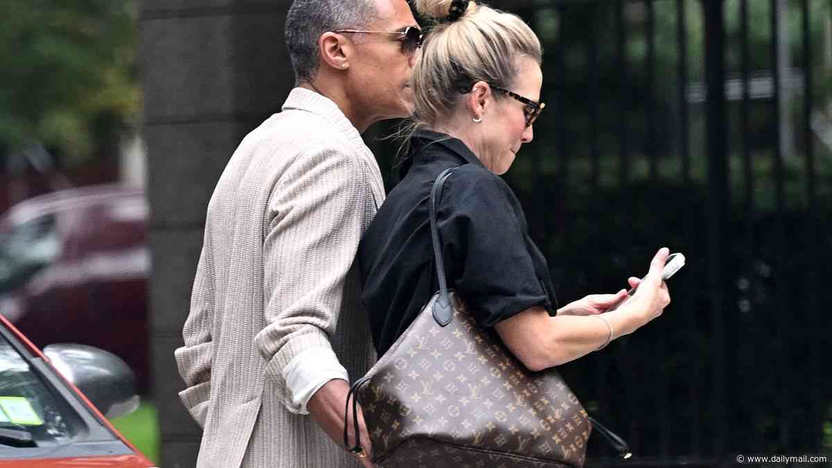 No butts about it…T.J. Holmes is still hands on with Amy Robach as newlyweds are spotted in NYC for the first time since tying the knot