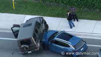 Shocking moment Mercedes G-Wagon being chased by cops drives on top of SUV being driven by mom with two children inside