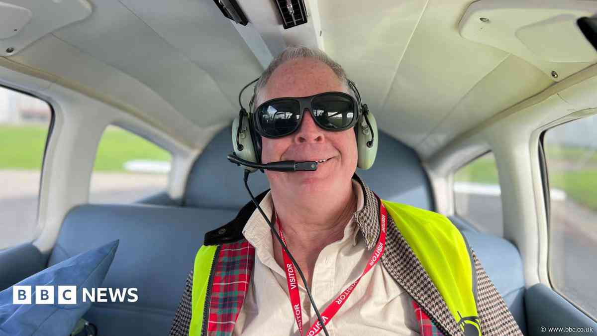 Visually impaired man at ease flying a plane