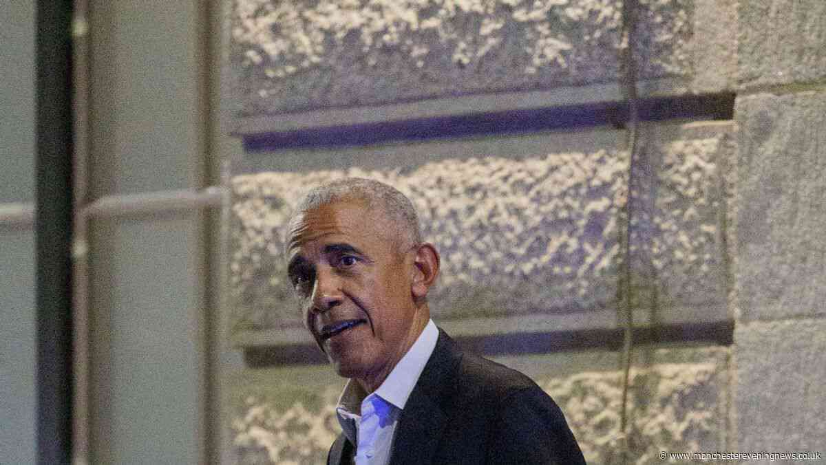 Former US president Barack Obama spotted striding out of swanky Manchester city centre hotel