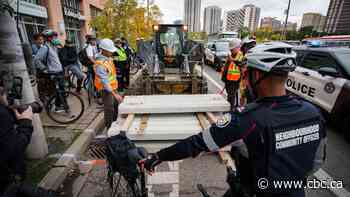 3rd person arrested as cyclists protest removal of bike lanes in Toronto