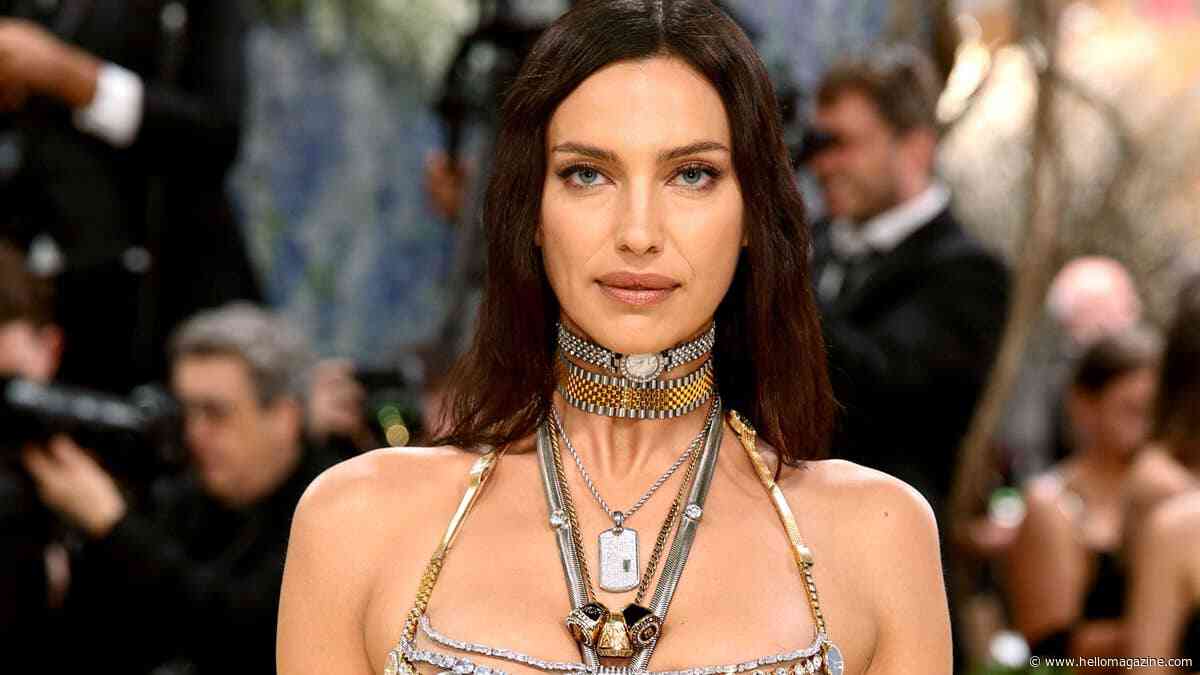 Irina Shayk, 40, poses topless in leather pants in candid backstage moment