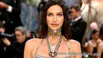 Irina Shayk, 40, poses topless in leather pants in candid backstage moment