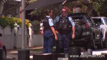 Inner-city Sydney suburb locked down after reports of gunfire as schoolkids hide under desks, roads shut, trains cancelled and locals ordered to stay inside