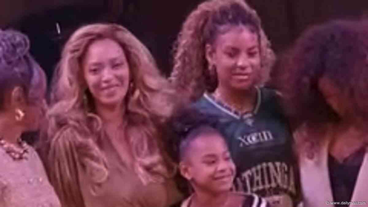 Beyonce's lookalike daughters Blue Ivy, 14, and Rumi, 9, join her for a rare public appearance in her hometown of Houston
