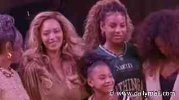 Beyonce's lookalike daughters Blue Ivy, 14, and Rumi, 9, join her for a rare public appearance in her hometown of Houston