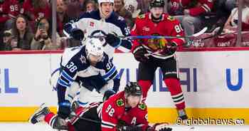 Winnipeg Jets rally from two goals down before losing in overtime 4-3 in Chicago