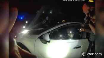 Body cam captures moments OKC officers find DUI driver asleep in the road with the car still in drive