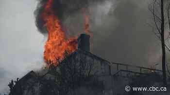 Homes burn in Southern California amid fast-moving fire, prompting evacuation orders