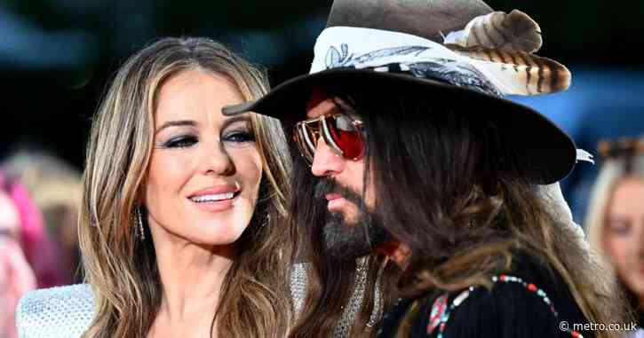 Liz Hurley flashes engagement ring as she gets engaged to Billy Ray Cyrus