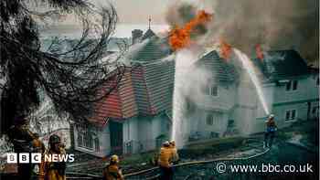 Evacuation orders as fast-moving California wildfire burns homes