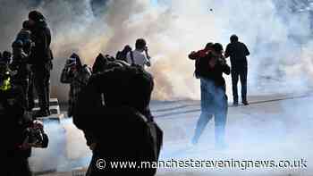 Tear gas and water cannons used against protesters in Paris