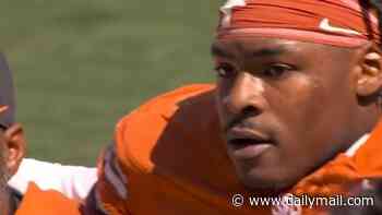 Top NFL draft prospect Colin Simmons carted off field after suffering worrying injury in Texas' clash with Florida