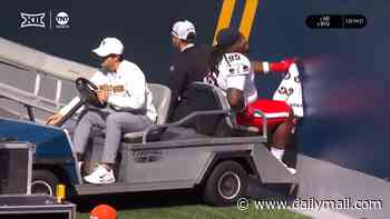 Remarkable moment clueless staffer leaves injured football star screaming in pain after reversing medical cart into a wall